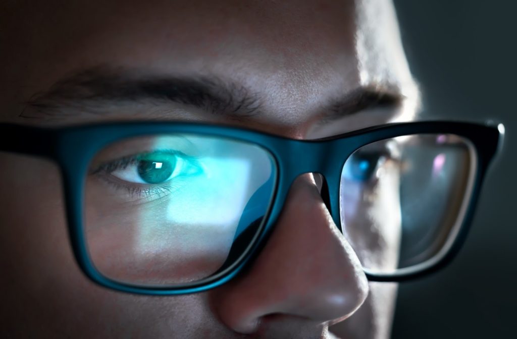 Man using computer glasses to prevent eye strain