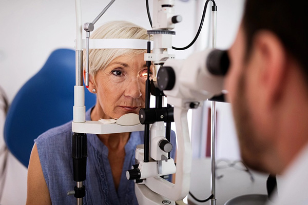 Old woman having an eye exam at La Paz Optometric Center
