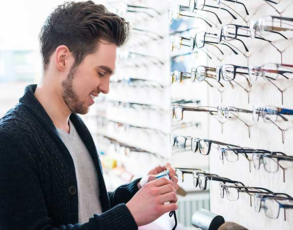 Man looking for his perfect eyeglasses in Fountain Valley