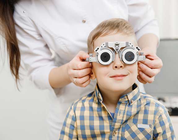 Young child getting an eye exam in Fountain Valley